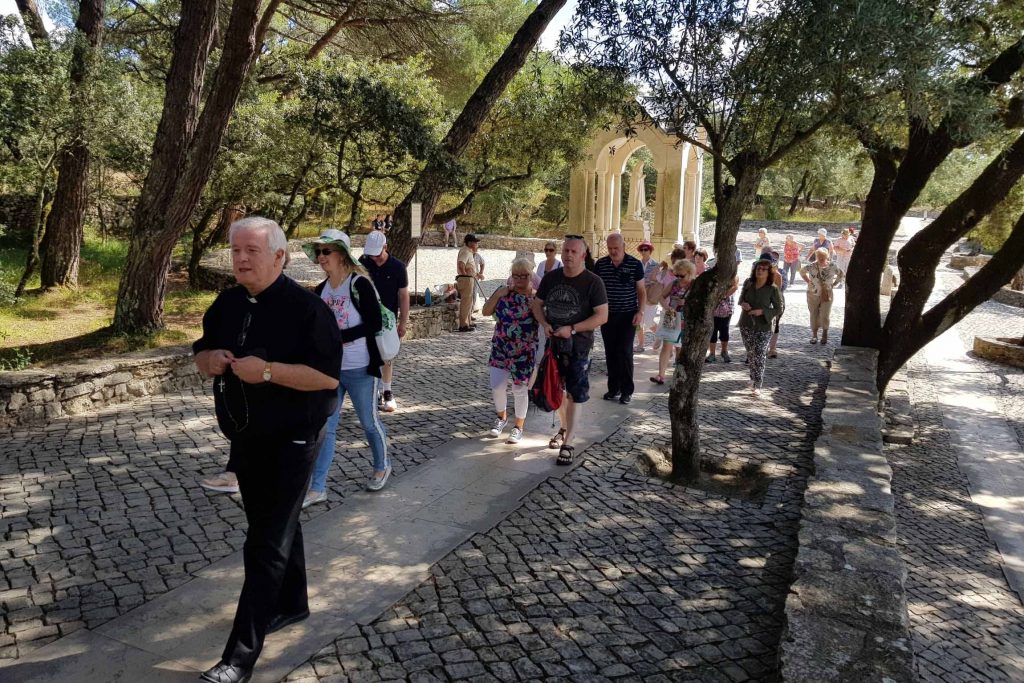 priest and group Hungarian Stations of the Cross in Fatima Joe Walsh Tours Pilgrimages